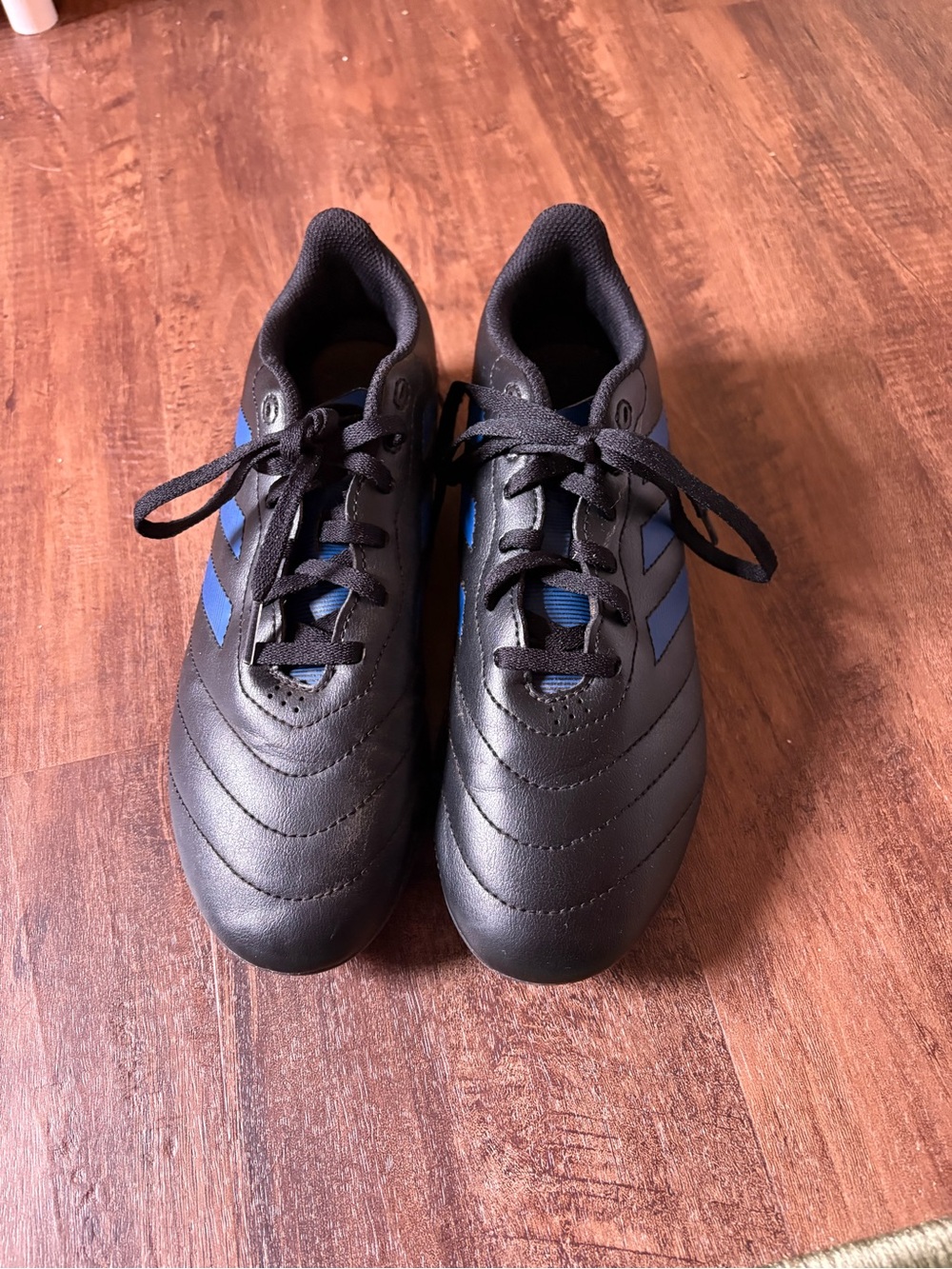 Adidas Black Athletic Cleats with Blue Accents